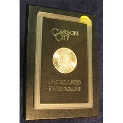 1596. 1884 CC Morgan Silver Dollar in original black box of issue with official card. MS 63/65.