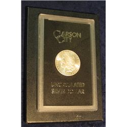 1599. 1884 CC Morgan Silver Dollar in original black box of issue with official card. MS 63.