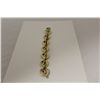 Image 1 : ONE 14KT YELLOW GOLD AND WHITE GOLD ITALIAN MADE MODERN LINK STYLE BRACELET. THE BRACELET WEIGHS