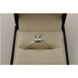 ONE LADIES 14KT WHITE GOLD DIAMOND SET ENGAGEMENT OR DRESS RING. MADE IN A CLASSIC SOLITAIRE