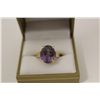 Image 1 : ONE LADIES 10KT YELLOW GOLD NATURAL AMETHYST RING. SET WITH 1 OVAL MIXED CUT NATURAL AMETHYST 7.45