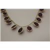 Image 2 : ONE 14KT YELLOW GOLD RUBY NECKLACE BEZEL SET WITH 15 DANGLING OVAL SHAPED BEZEL STYLE PENDANTS.