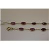 Image 2 : ONE 14KT YELLOW GOLD RUBY BRACELET. SET WITH 12 OVAL MIXED CUT RUBIES 6.3 CARAT. WEIGHS 2.1 GRAM,