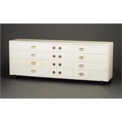 TOMMI PARZINGER white lacquered eight-drawer chest with twenty-four rectangular divisions to the...