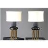 Image 1 : Pair of JAMES MONT custom-designed table lamps, en suite with preceding, each with eight brass ba...