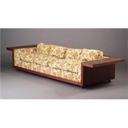 Large VLADIMIR KAGAN walnut veneer sofa with broad shelf arms, reupholstered in floral print fabr...