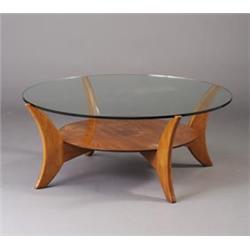 Fine VLADIMIR KAGAN cherry coffee table with a circular plate glass top inset on curved legs join...