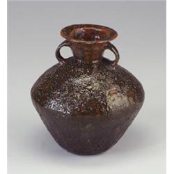 Fine and unusual BEATRICE WOOD bulbous urn with covered in a cratered chocolate brown over mahoga...