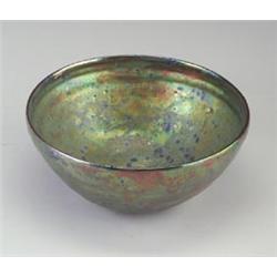 Fine and large BEATRICE WOOD bowl covered in a mottled green, gold lavender lustered glaze. Signe...