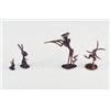 Image 1 : Four HAGENAUER figurines: hunter pointing gun with rabbit behind him, and three whimsical rabbits...