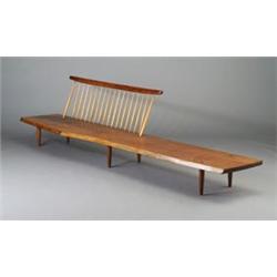 Unusual GEORGE NAKASHIMA long spindle-back walnut bench with free-edge plank seat on six tapering...