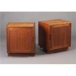Pair of GEORGE NAKASHIMA walnut nightstands, each with dovetail case construction and single cabi...