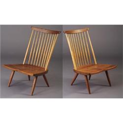 Two GEORGE NAKASHIMA spindle-back walnut lounge chairs, 1978, with broad saddle seats and flaring...