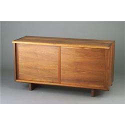 GEORGE NAKASHIMA walnut credenza with dovetailed case construction, free edge, and two sliding pa...