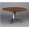 Image 1 : OSWALDO BORSANI dining table with four arched chrome bands under a circular wood veneer top with...