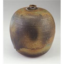 Large TOSHIKO TAKAEZU stoneware bulbous vessel with closed-in rim, covered in a mottled beige, bl...