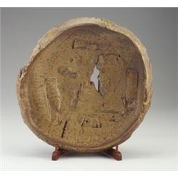 Fine and massive PETER VOULKOS stoneware charger, 1990, with ripped rim and opening, heavily work...