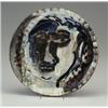 Image 1 : PETER VOULKOS stoneware charger with stylized face in blue, black, brown and white. Half-inch chi...