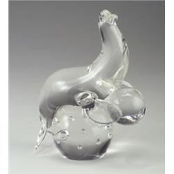 SEGUSO clear glass sculpture of a seal on a ball with submerged interior bubbles. Etched signatur...