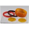 Image 1 : Four Art Deco Bakelite pieces including three carved bangle bracelets, one brown, one cinnabar, a...