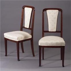 Pair of LOUIS MAJORELLE mahogany side chairs with footed forelegs and white brocade upholstered b...