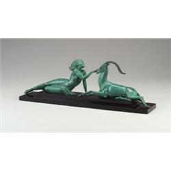 Art Deco bronze table sculpture depicting a nude with antelope, in verdigris patina mounted on a...