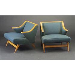 Two blondwood armchairs, 1940's, with saber legs and curvilinear arms, upholstered in blue-green...