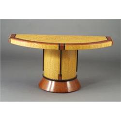 Fine demi-lune console table of satinwood veneer with exotic wood inlay on flaring pedestal base....