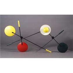 Wall-mounted light sculpture of enameled metal with black tubular rods, discs and spheres in prim...