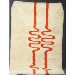 Contemporary ivory wool rug with two orange "radio waves." Excellent condition with only minor we...