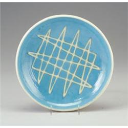 MAIJA GROTELL stoneware charger with squeezebag cross-hatched decoration on a glossy blue ground....
