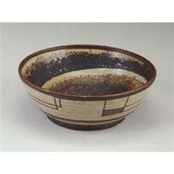 JOHN FOSTER wheel-thrown stoneware bowl with umber underglaze, the exterior with geometric forms,...
