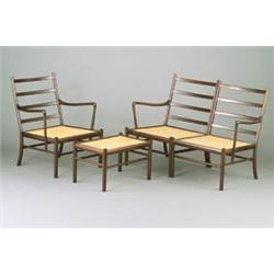 OLE WANSCH three-piece mahogany suite: ladderback settee, armchair and matching footstool with rat..