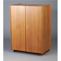 Danish walnut veneer desk cabinet with two doors enclosing shelves, cubby holes, a drawer and pul...