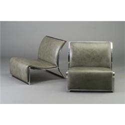 Pair of lounge chairs, c. 1950's, each with bright chrome ribbon frame and gray leather seat and...