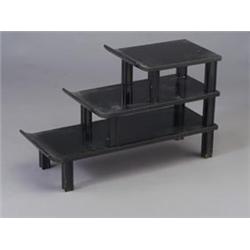 JAMES MONT three-tiered Chinese shelving unit, each with an upswept top and cruciform legs. Consi...