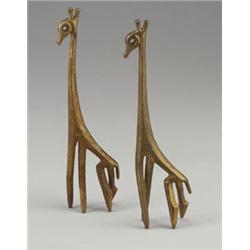 Pair of FREDERICK WEINBERG cast brass stylized giraffes. Original patina. Each stamped copyrigh...