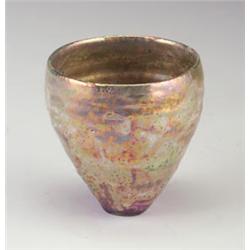 Unusual BEATRICE WOOD ovoid vessel covered in a mottled gold, green, and lavender lustered glaze....