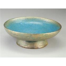 Fine and large BEATRICE WOOD footed centerbowl, the exterior covered in a lustered green, gold an...