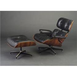 CHARLES EAMES for HERMAN MILLER lounge chair and ottoman with rosewood veneer frame and tufted bl...
