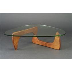 ISAMU NOGUCHI biomorphic coffee table with walnut base and glass top. Unmarked. 16" x 51" $2,500...