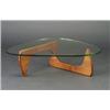 Image 1 : ISAMU NOGUCHI biomorphic coffee table with walnut base and glass top. Unmarked. 16" x 51" $2,500...