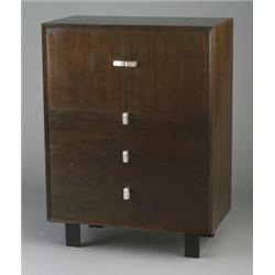 GEORGE NELSON for HERMAN MILLER walnut veneer dresser with two doors enclosing fitted interior, o...