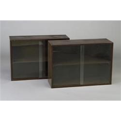 Pair of GEORGE NELSON for HERMAN MILLER dark walnut veneer cabinets, each with interior shelf and...