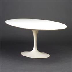 EERO SAARINEN for KNOLL oval dining table with white laminate top on white enameled pedestal base...