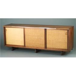 GEORGE NAKASHIMA walnut cabinet with dovetailed case, free-edge, and three sliding linen-covered...