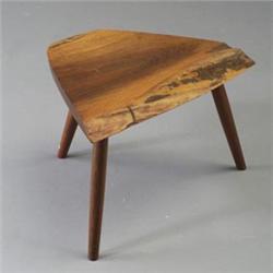 GEORGE NAKASHIMA three-legged stool, c. 1970, with triangular top with two free-edges on flaring...