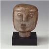 Image 1 : Primitive soapstone carved head with prominent nose, open mouth and hair. Mounted on black wood b...