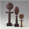 Image 1 : Three wood female fertility figures: Two Asante, Ghana, "akuaba," of stylized cylindrical form, r...