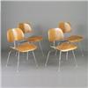 Image 1 : Four CHARLES EAMES for HERMAN MILLER DCM chairs with walnut finish on bright chrome tubular frame...